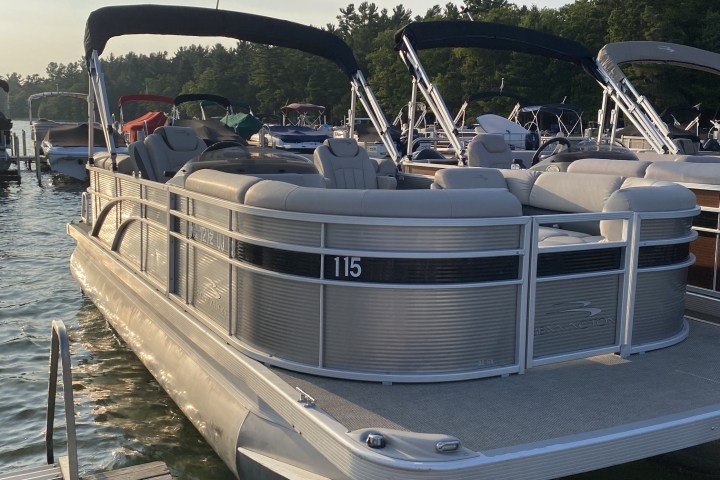 a boat that is sitting on a dock next to a body of water